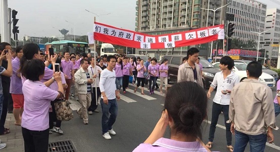 Strikes and protests increase in China due to unpaid wages and factory closures